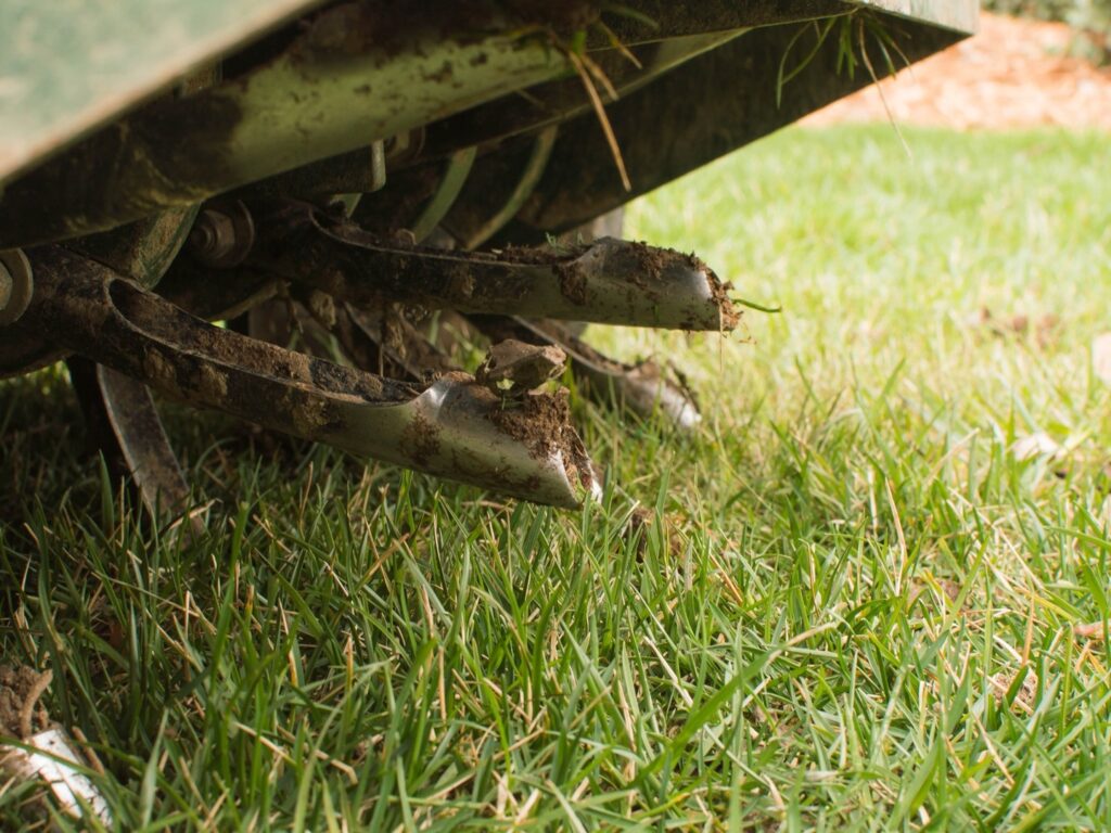 Core aeration machine on lawn